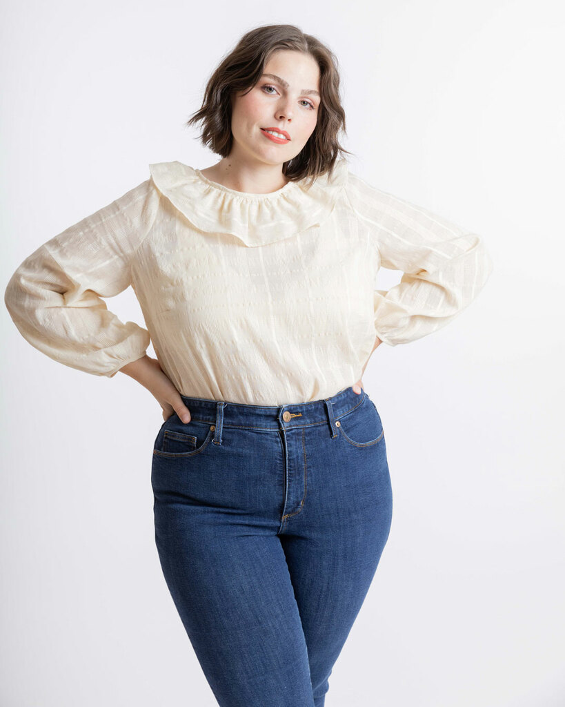 A woman models the front of the blouse pattern