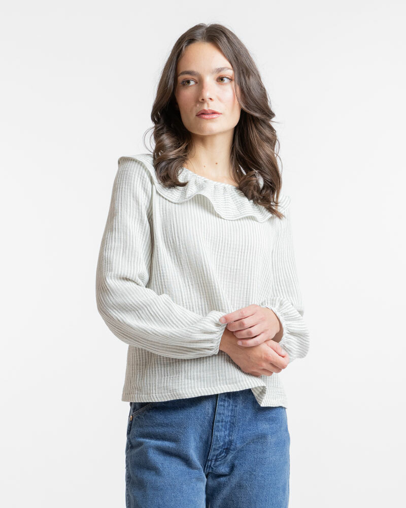 A woman models the blouse pattern