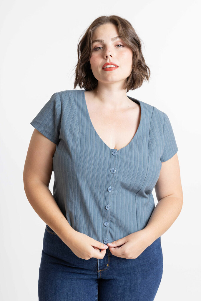 Morgan modeling the front of the Sage blouse with cap sleeves in blue yarn dyed cotton