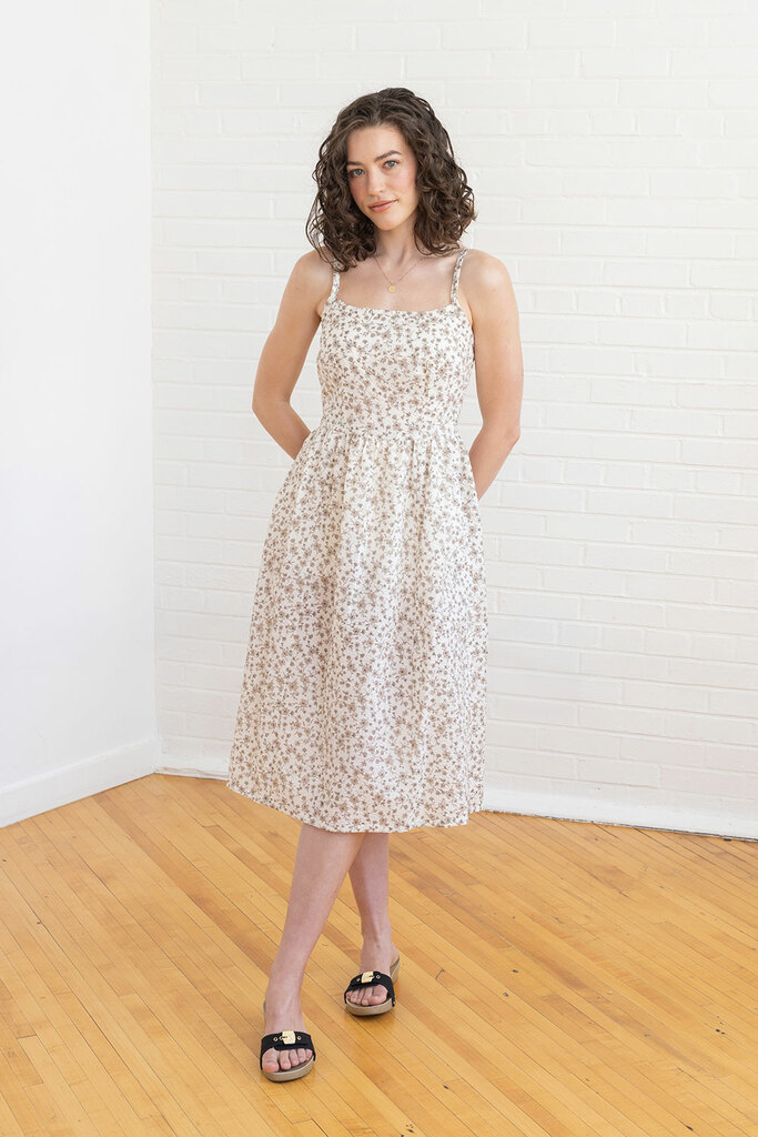 woman standing in floral Mora dress