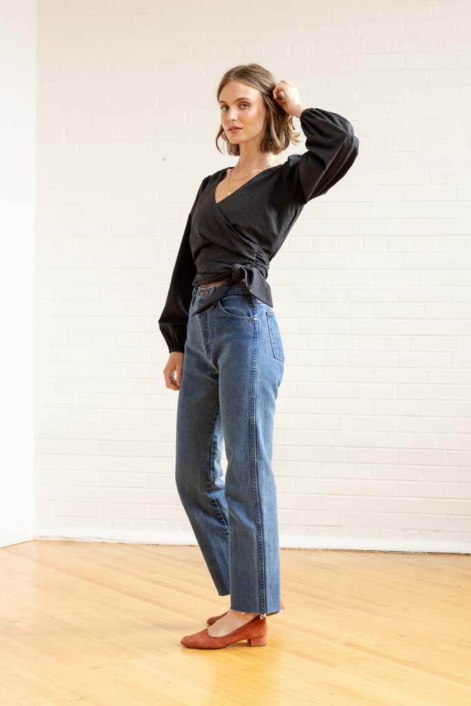 Woman wearing black Idra top