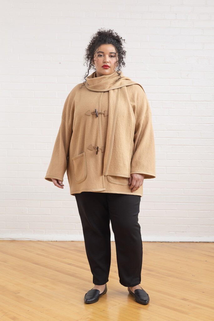 woman modeling the camel Ivy coat