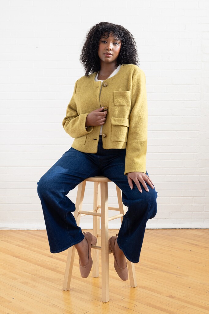Woman modeling the lime green Rhoda jacket