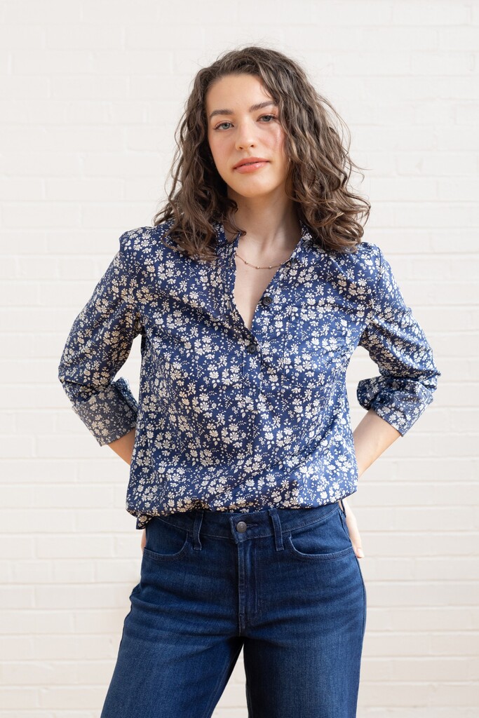 Woman wearing a floral Thyme shirt