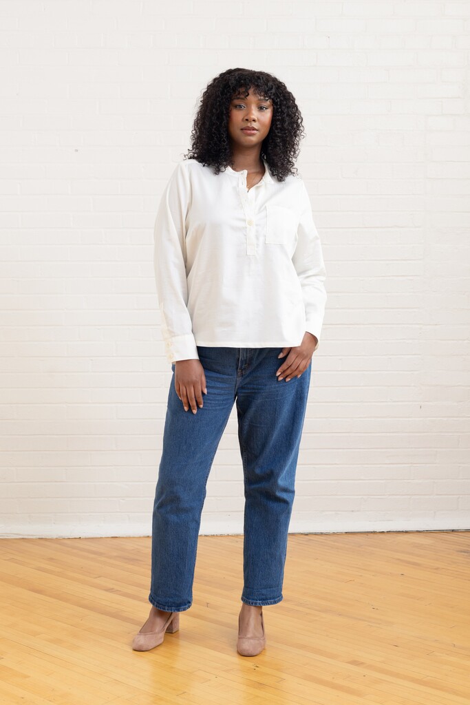 Woman modeling a white Thyme shirt