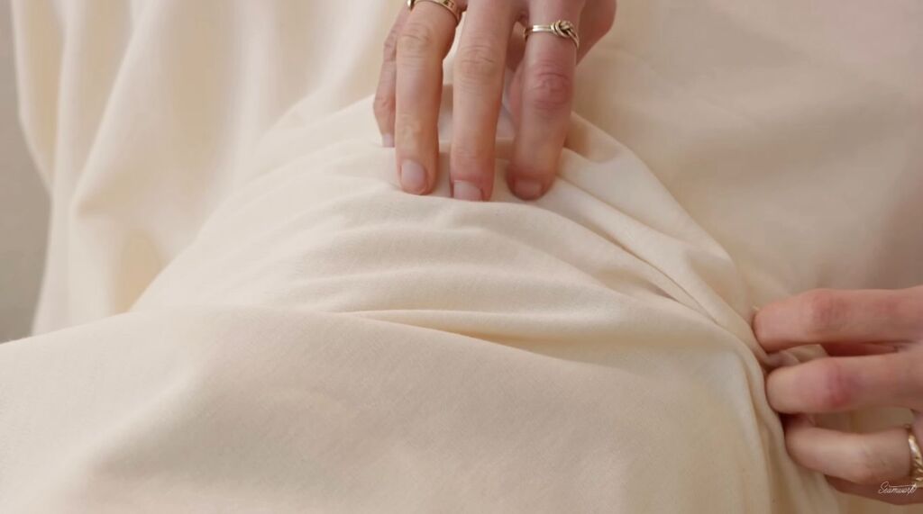 Cream merino wool interlock knit fabric