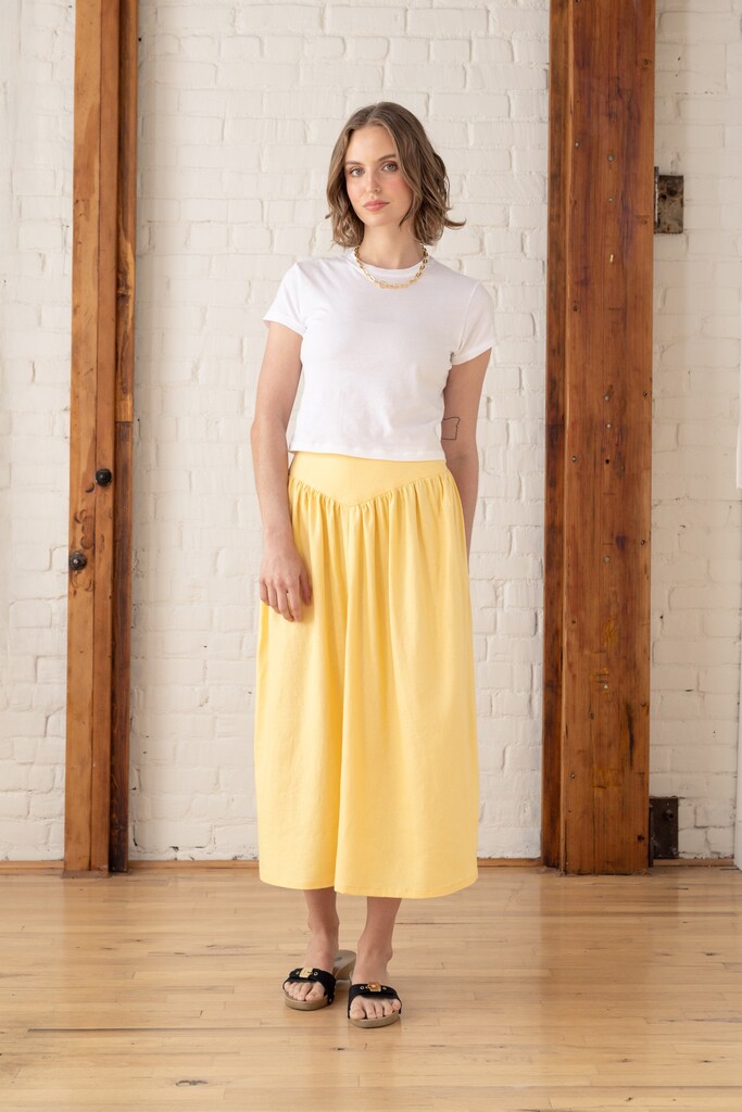 Model wearing a yellow Elowen skirt
