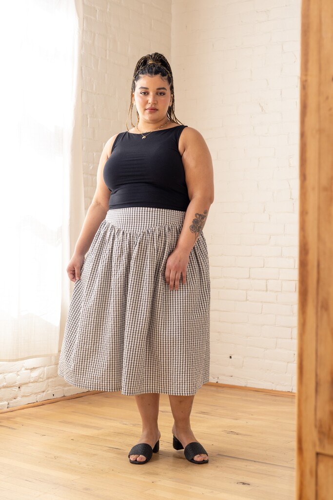 Model wearing a black and white Elowen skirt