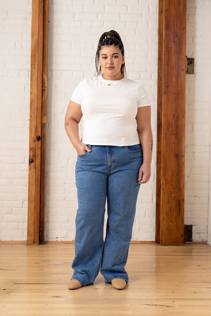 Woman wearing a white Morgan t-shirt