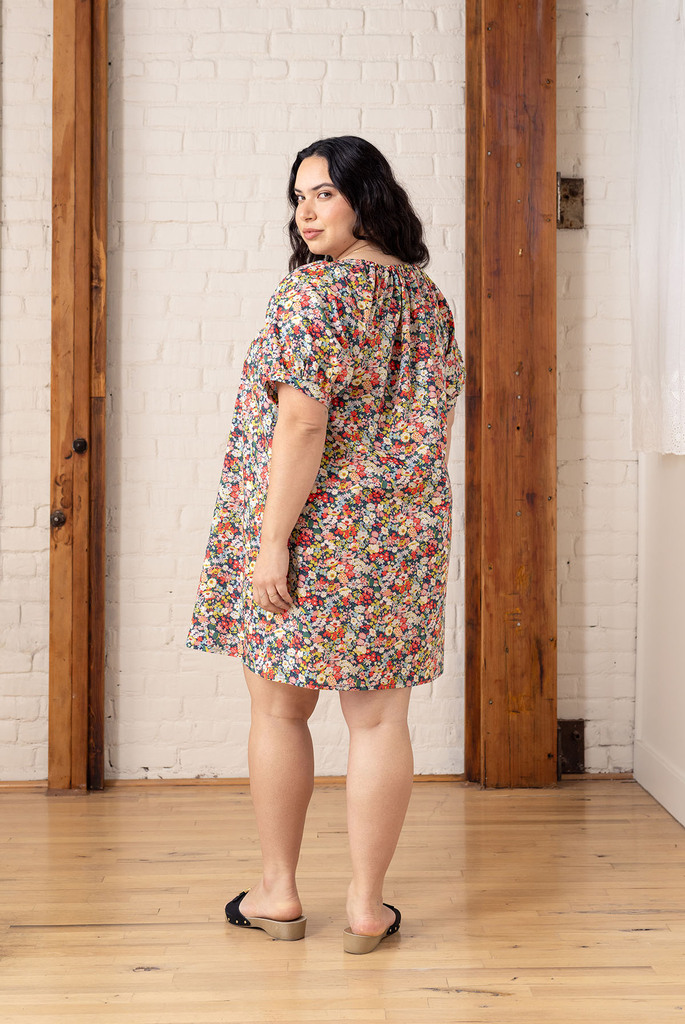 model back view of floral pearl dress