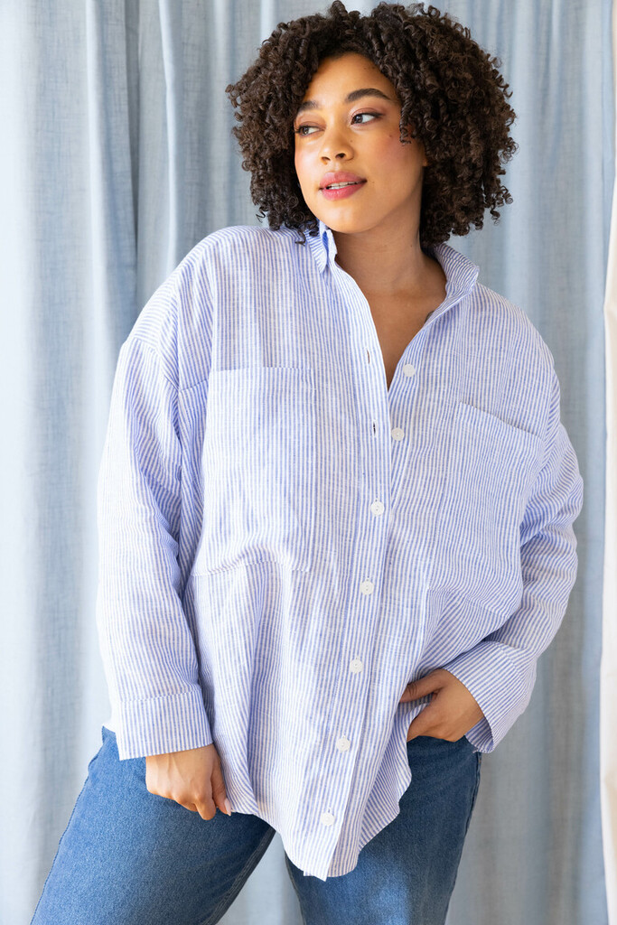 Close-up of Roan shirt sample in striped linen showing the button placket and chest pocket details
