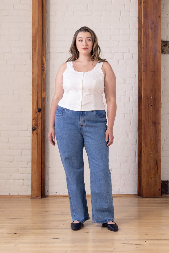 Model wearing white Cassis top