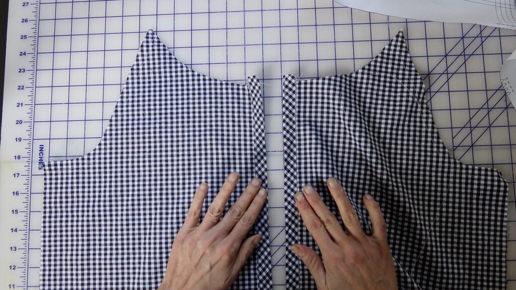 Close-up of a bias-cut placket on the Fern blouse in black and white gingham, showing the diamond/chevron effect