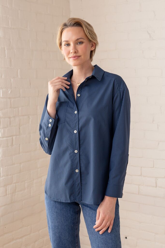 Woman modeling a navy Grove shirt