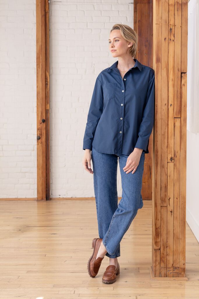 Model wearing a navy Grove button-up
