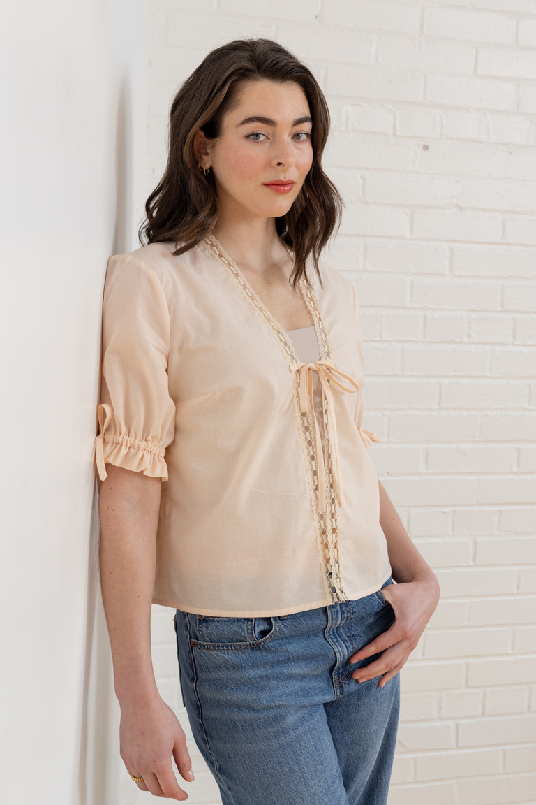 The Orchid Puff Sleeve Tie Front Top sewing pattern, from Seamwork