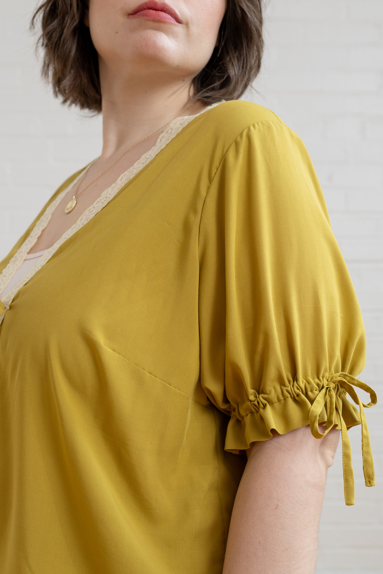 The Orchid Puff Sleeve Tie Front Top sewing pattern, from Seamwork