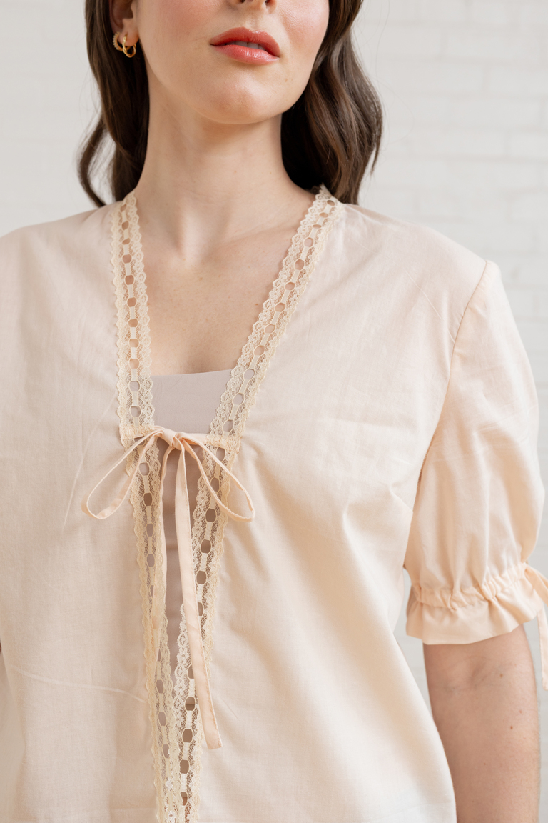 The Orchid Puff Sleeve Tie Front Top sewing pattern, from Seamwork