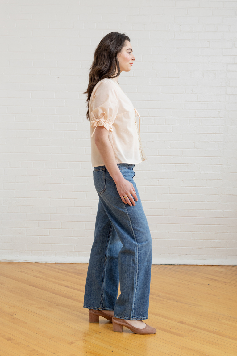 The Orchid Puff Sleeve Tie Front Top sewing pattern, from Seamwork